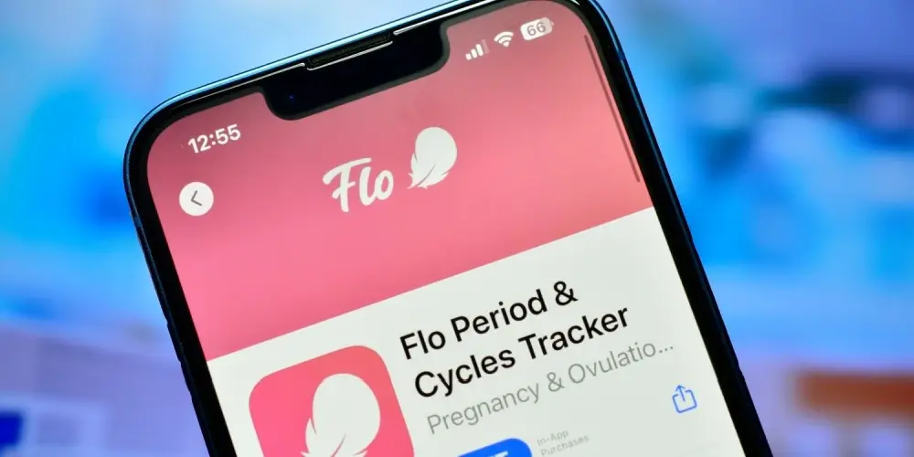 A phone with the Flo App displaying